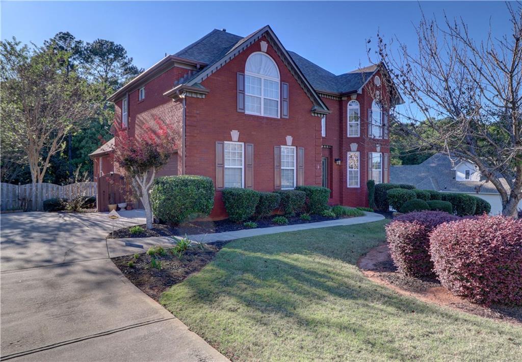 341 Rothaus Court Stockbridge, GA 30281 - Photo 1 of 1 a front view of a house with garden