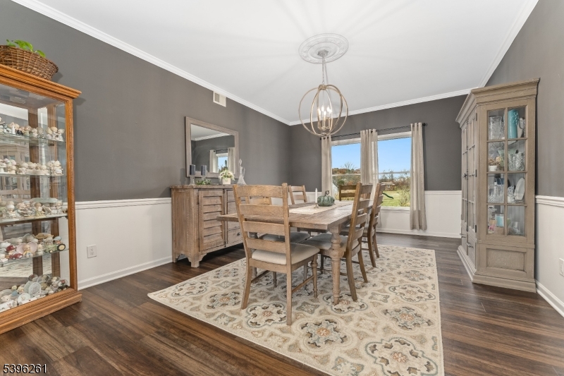 7 Maple Springs Road Pittstown, NJ 08867 - Photo 13 of 41 a view of a dining room with furniture and wooden floor