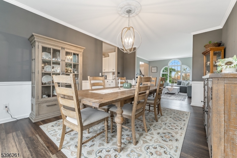 7 Maple Springs Road Pittstown, NJ 08867 - Photo 14 of 41 a dining room with furniture a chandelier and wooden floor