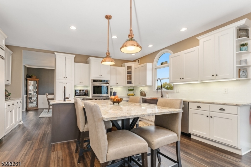 7 Maple Springs Road Pittstown, NJ 08867 - Photo 16 of 41 a large kitchen with a table and chairs