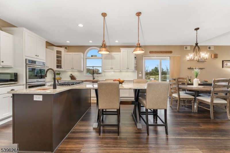 7 Maple Springs Road Pittstown, NJ 08867 - Photo 20 of 41 a dining hall with stainless steel appliances granite countertop a stove and kitchen view