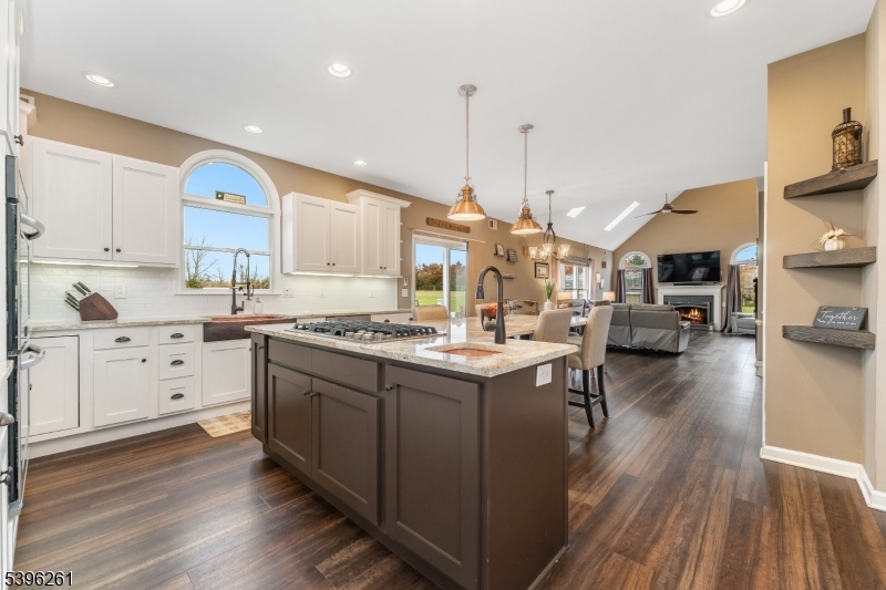 7 Maple Springs Road Pittstown, NJ 08867 - Photo 21 of 41 a kitchen with stainless steel appliances granite countertop a sink stove and wooden floor