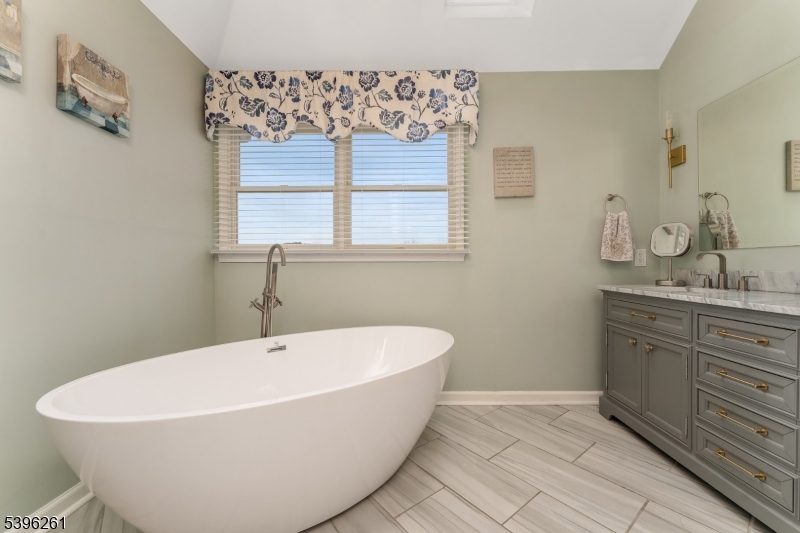 7 Maple Springs Road Pittstown, NJ 08867 - Photo 29 of 41 a white bath tub sitting in a bathroom