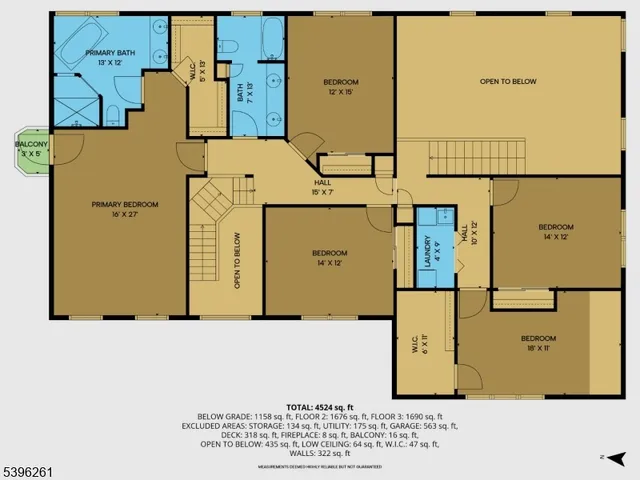 an aerial view of ocean and residential houses with outdoor space