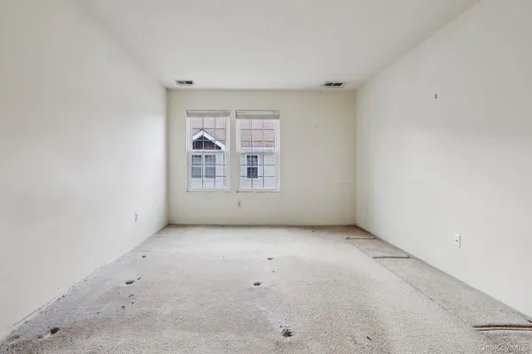 an empty room with a bathroom