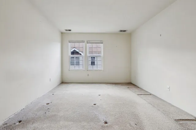 an empty room with a bathroom
