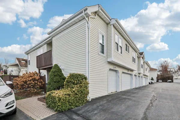 a view of a house with a parking space