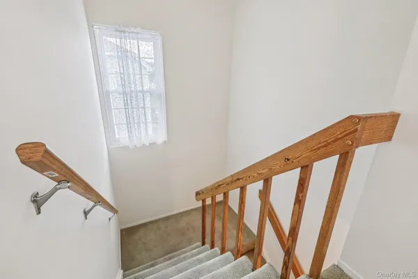 a view of entryway with stairs