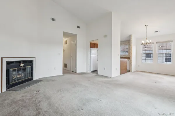 a view of a kitchen with a microwave and cabinets