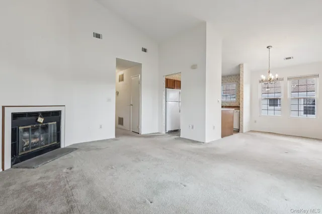 a view of a kitchen with a microwave and cabinets