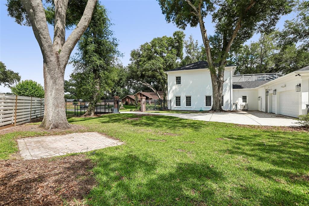 1012 Morfield Lane Brandon, FL 33511 - Photo 75 of 100 a house with huge green field in front of it
