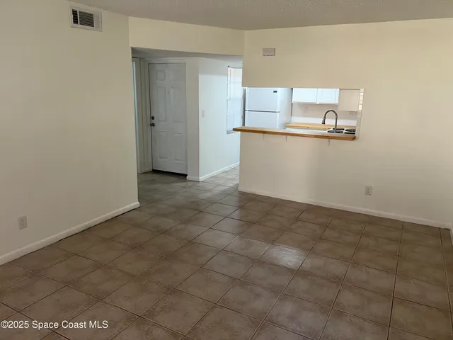 a view of a kitchen with a sink
