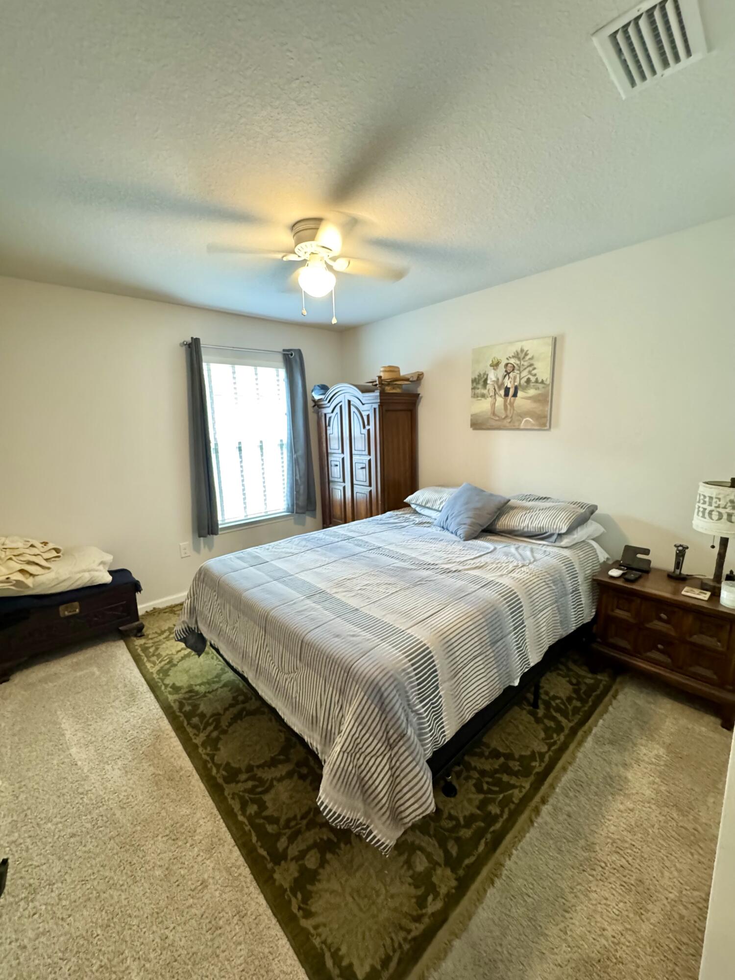 629 Earl Godwin Road Freeport, FL 32439 - Photo 16 of 36 a bedroom with a bed and window