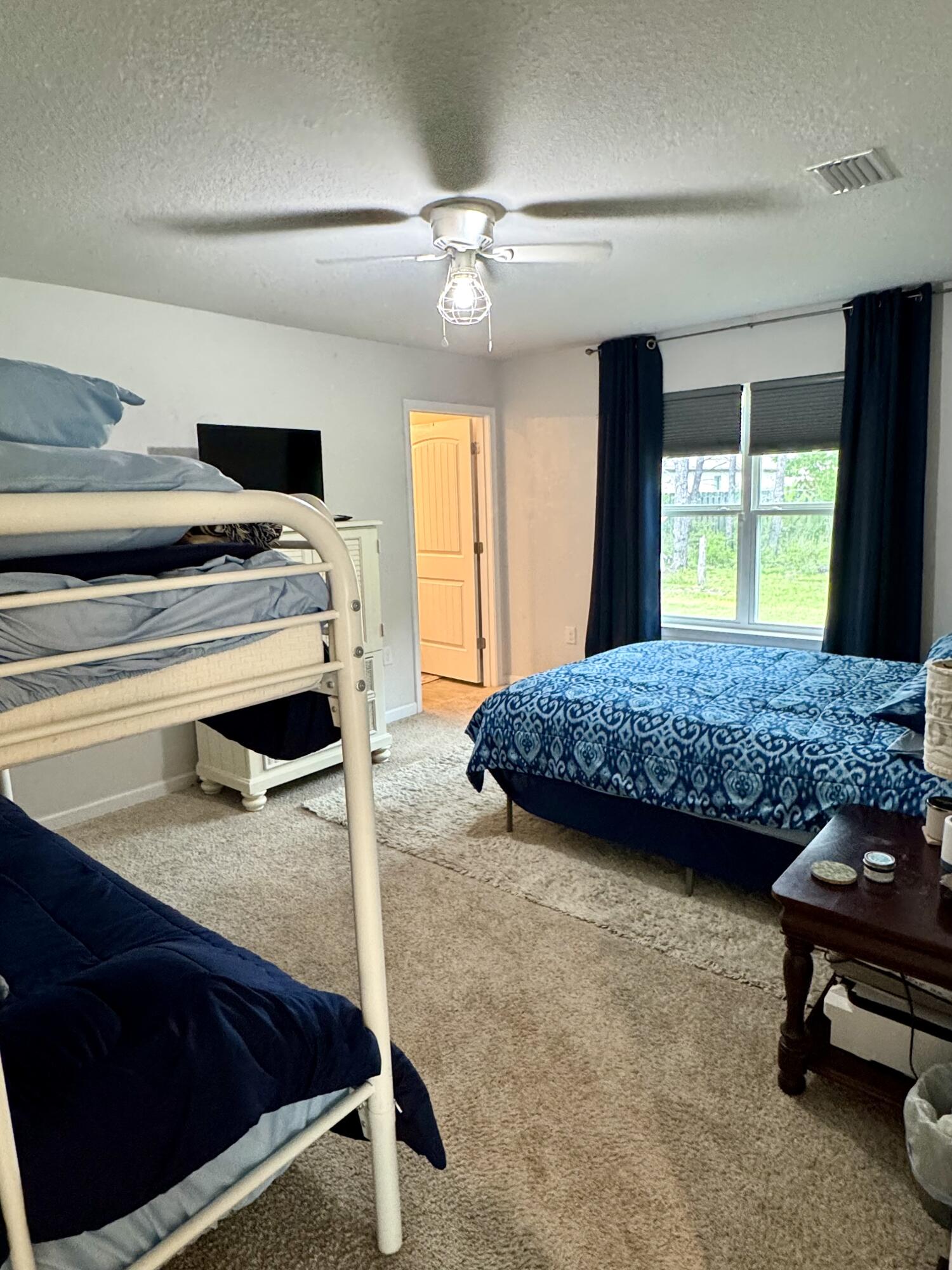 629 Earl Godwin Road Freeport, FL 32439 - Photo 19 of 36 a living room with furniture and a table