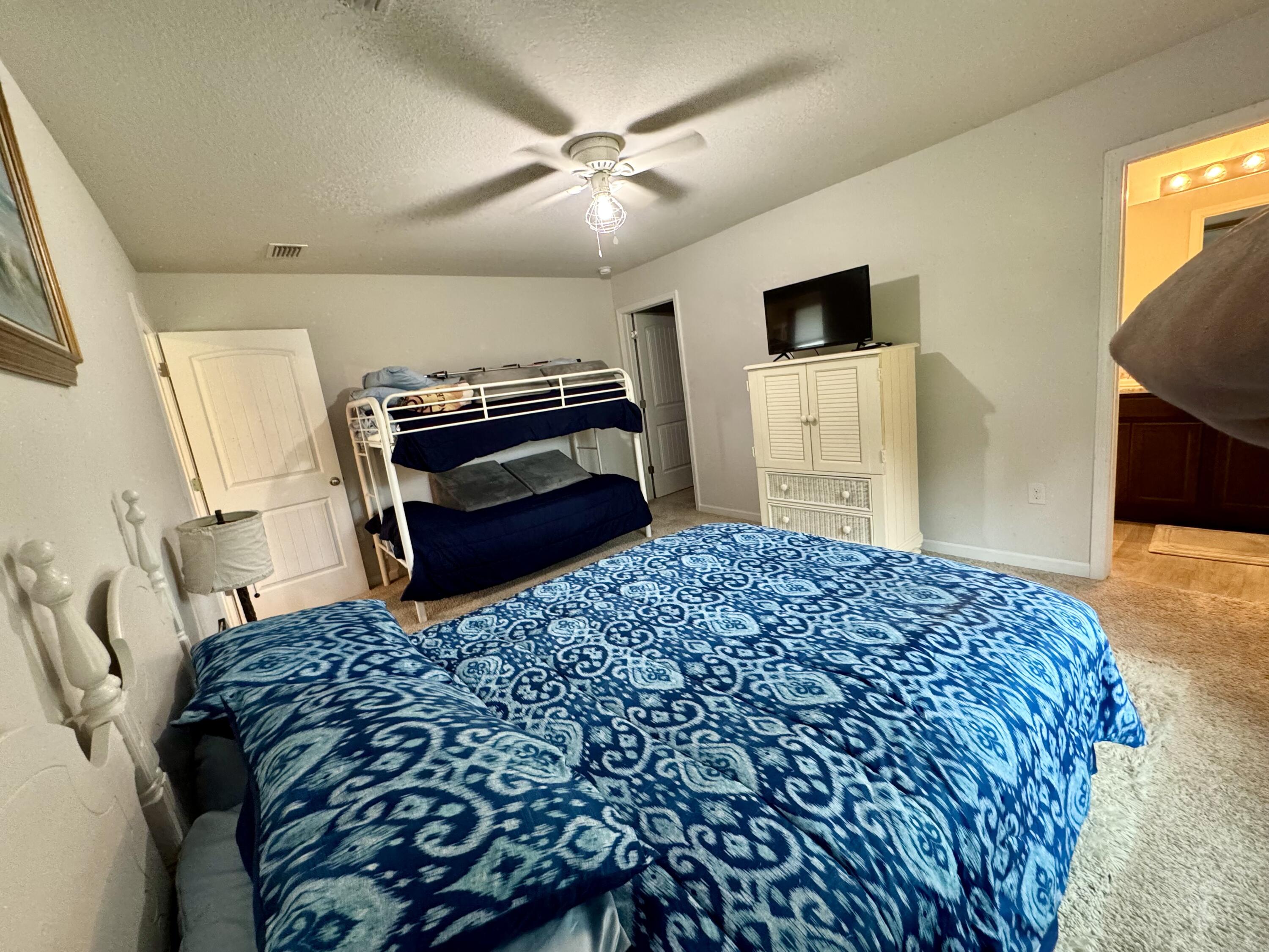 629 Earl Godwin Road Freeport, FL 32439 - Photo 20 of 36 a bedroom with a bed and a television