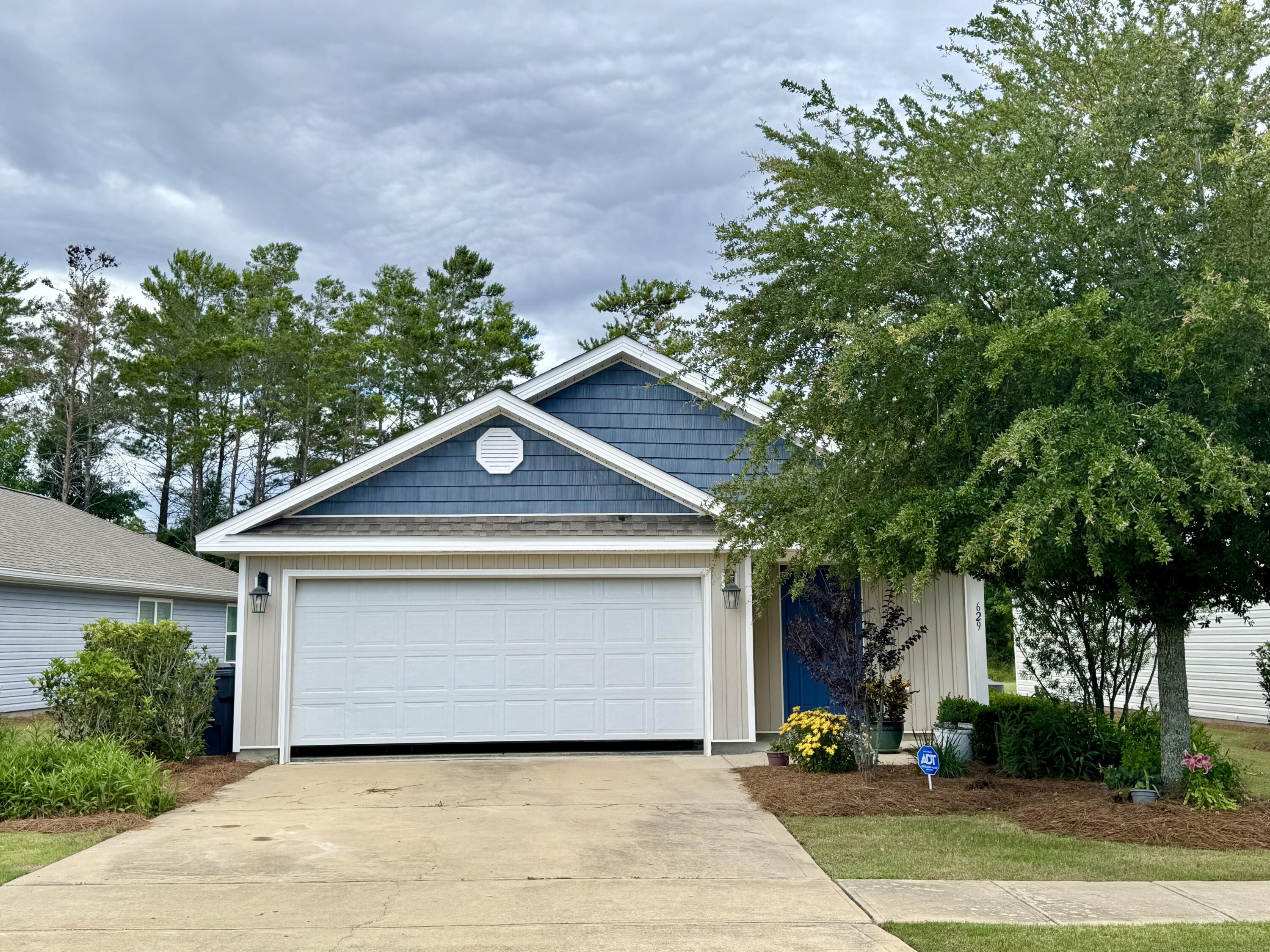 629 Earl Godwin Road Freeport, FL 32439 - Photo 2 of 36 a front view of a house with a yard