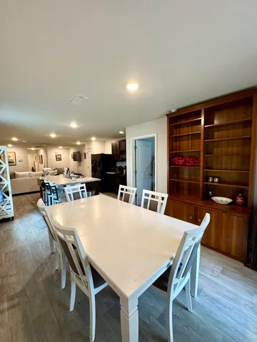 a kitchen with a table and chairs in it