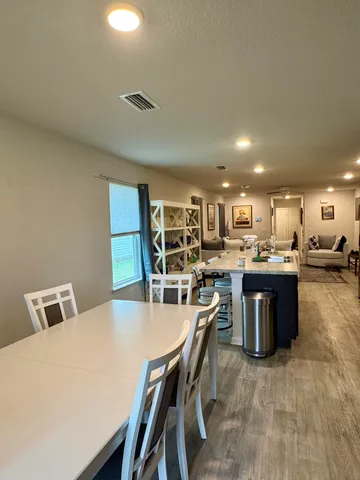 a living room with furniture and a table