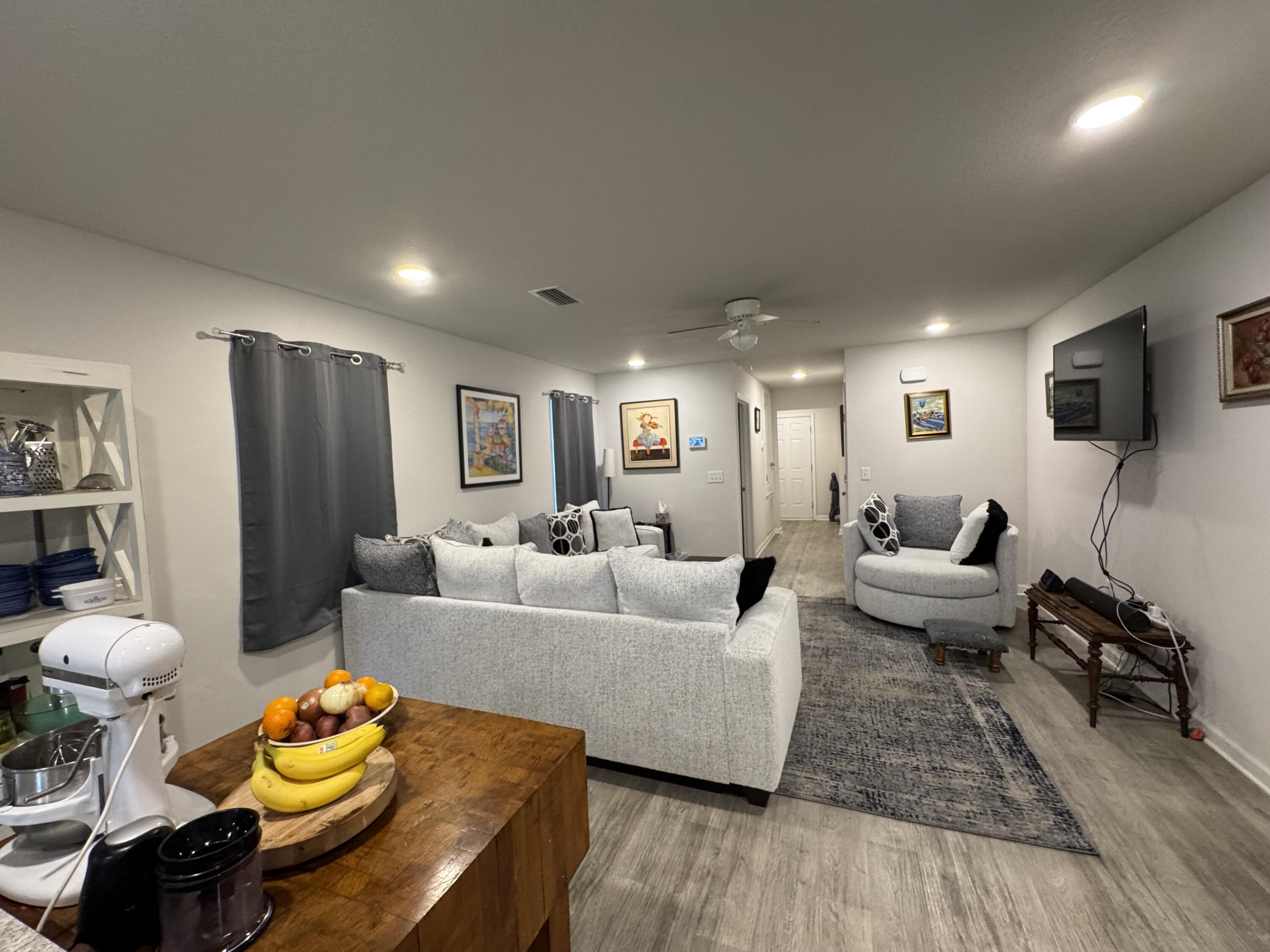 629 Earl Godwin Road Freeport, FL 32439 - Photo 25 of 36 a living room with furniture and a table