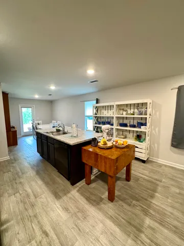 a living room with a furniture and a table
