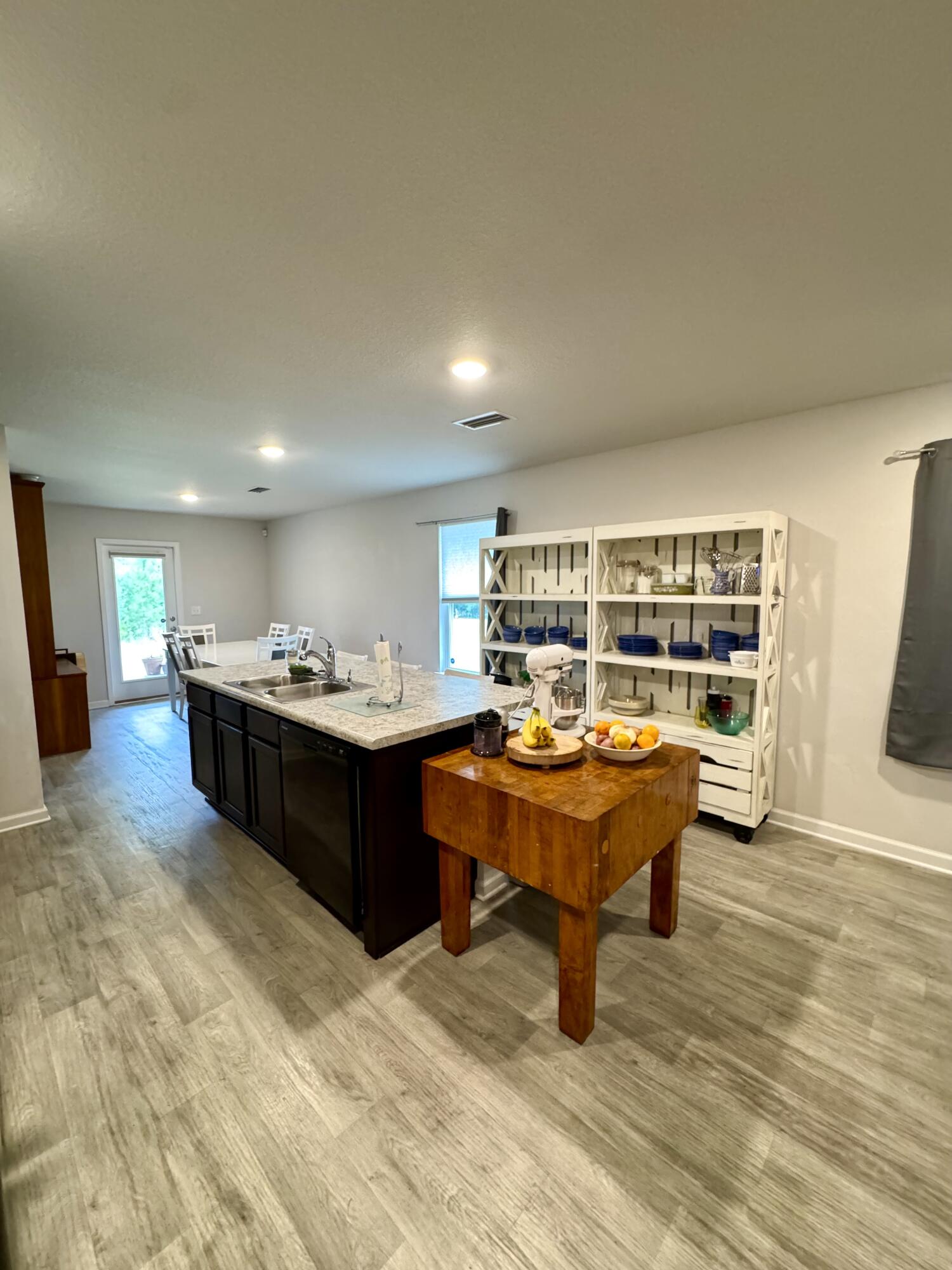 629 Earl Godwin Road Freeport, FL 32439 - Photo 10 of 36 a living room with a furniture and a table