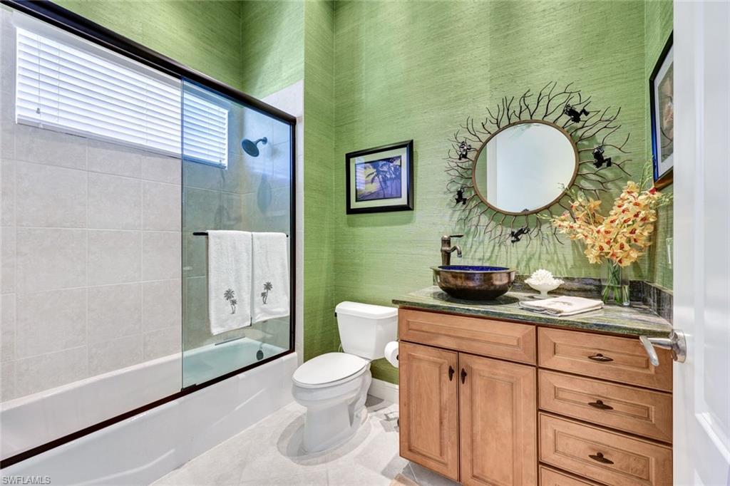 15516 Monterosso Lane, Unit 101 Naples, FL 34110 - Photo 21 of 31 Full bathroom featuring vanity, enclosed tub / shower combo, and wallpapered walls