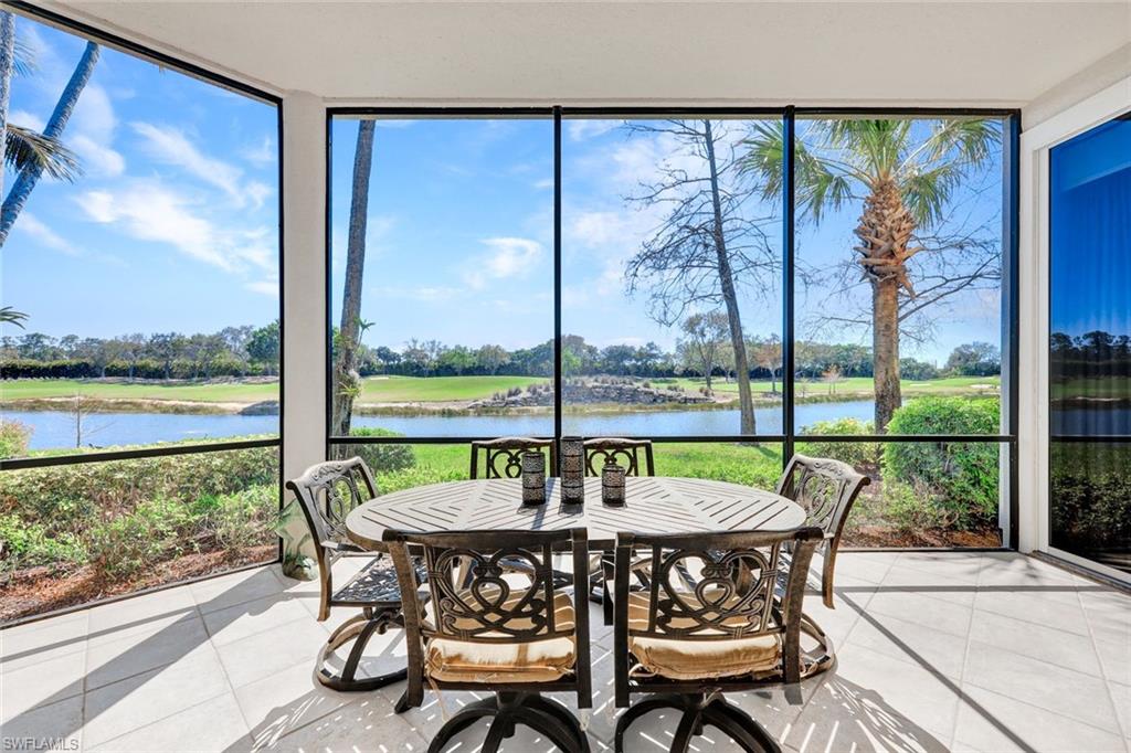 15516 Monterosso Lane, Unit 101 Naples, FL 34110 - Photo 5 of 31 Sunroom featuring a water view and tile patterned flooring