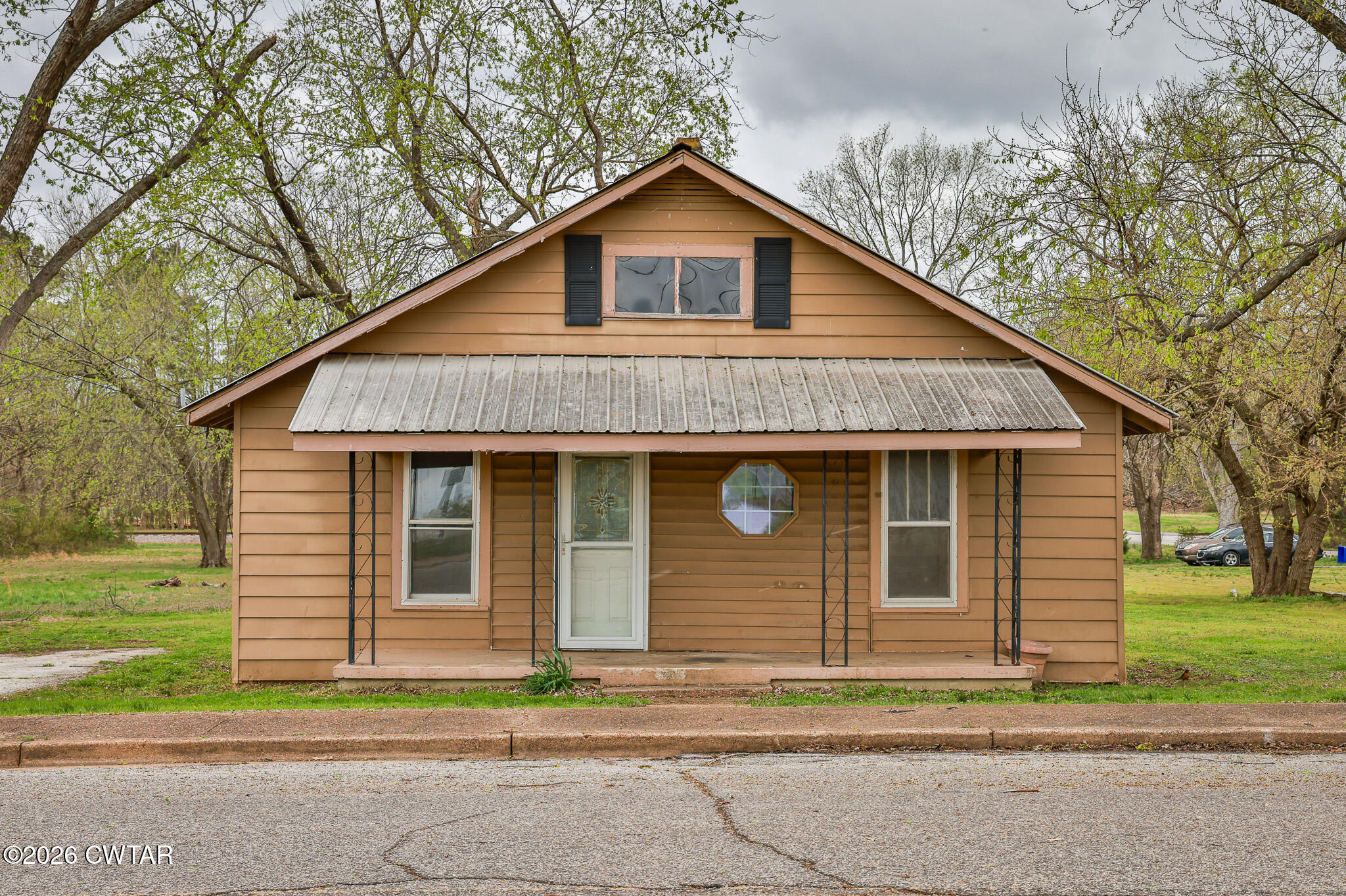 509 North Cedar Street Gleason, TN 38229 - Photo 1 of 26 a front view of a house with a yard