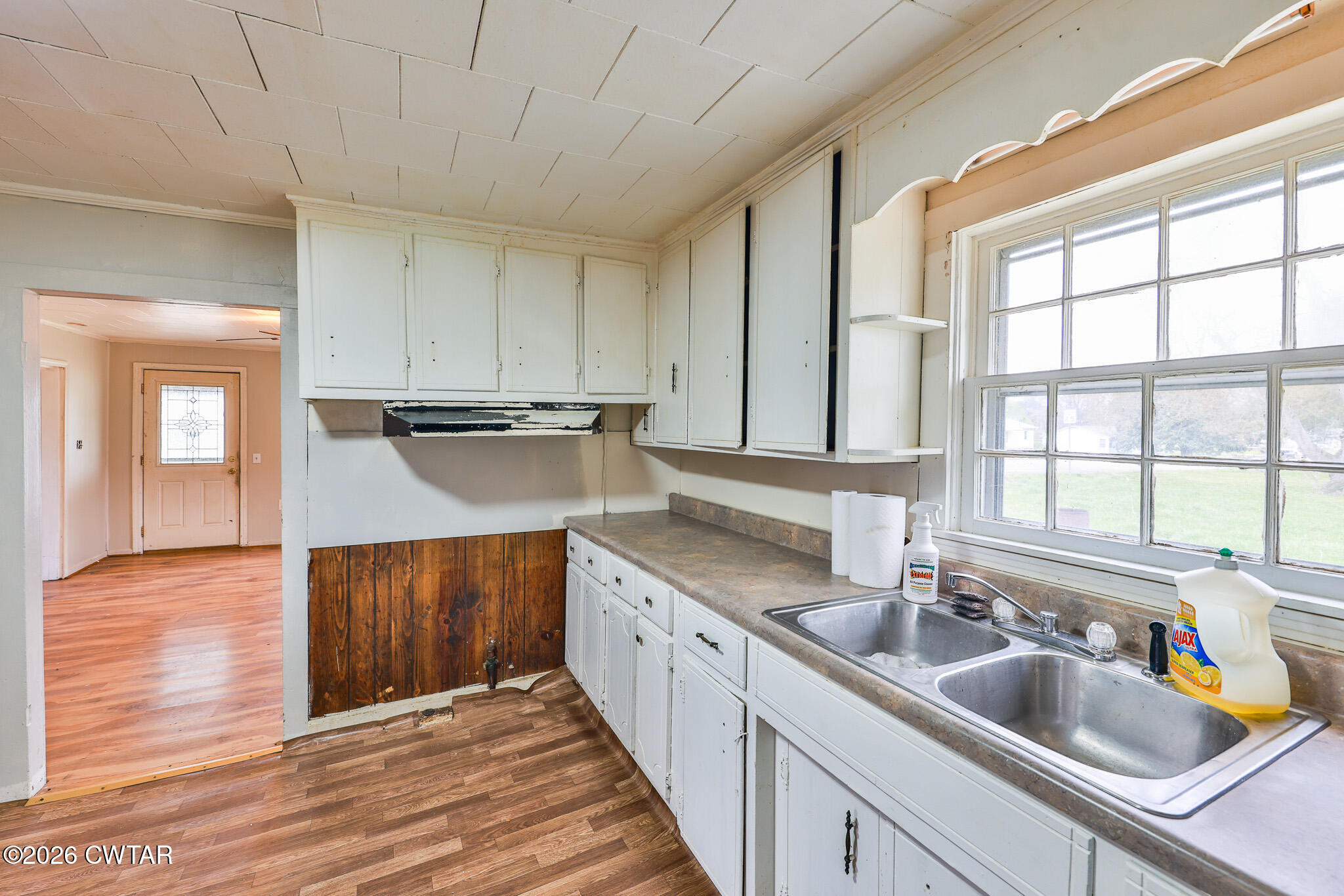 509 North Cedar Street Gleason, TN 38229 - Photo 12 of 26 a kitchen with stainless steel appliances granite countertop a sink and wooden cabinets
