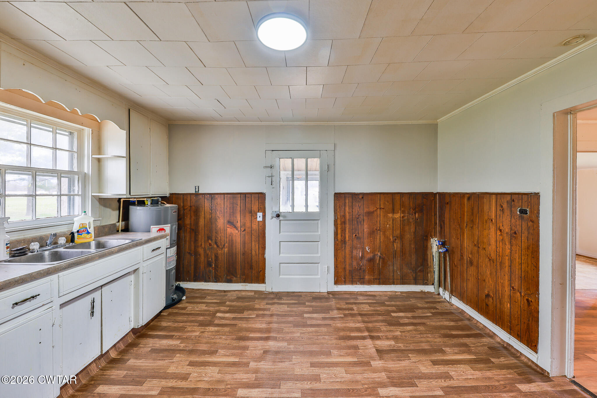 509 North Cedar Street Gleason, TN 38229 - Photo 13 of 26 a kitchen with wooden cabinets and sink