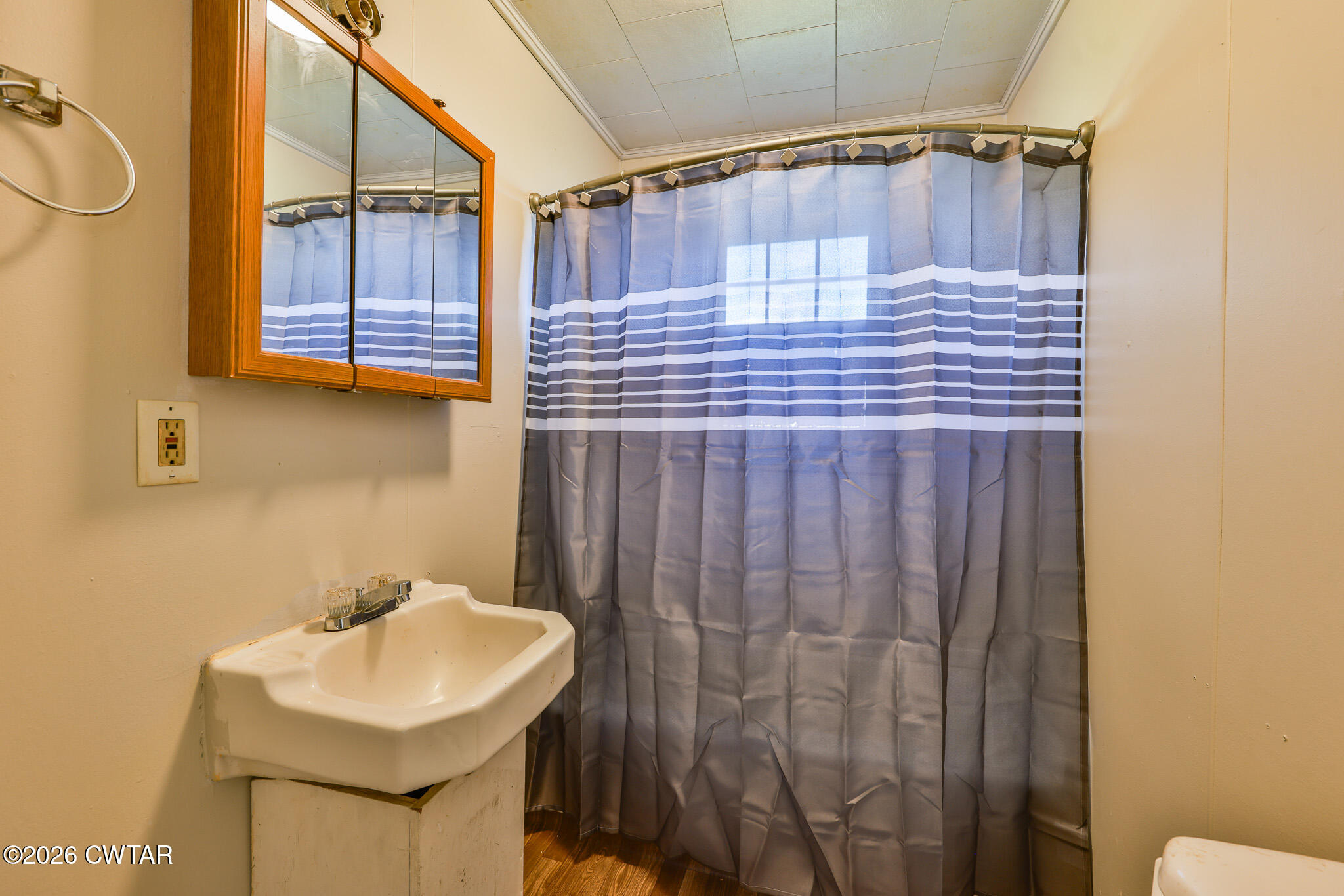 509 North Cedar Street Gleason, TN 38229 - Photo 15 of 26 a bathroom with a sink and mirror
