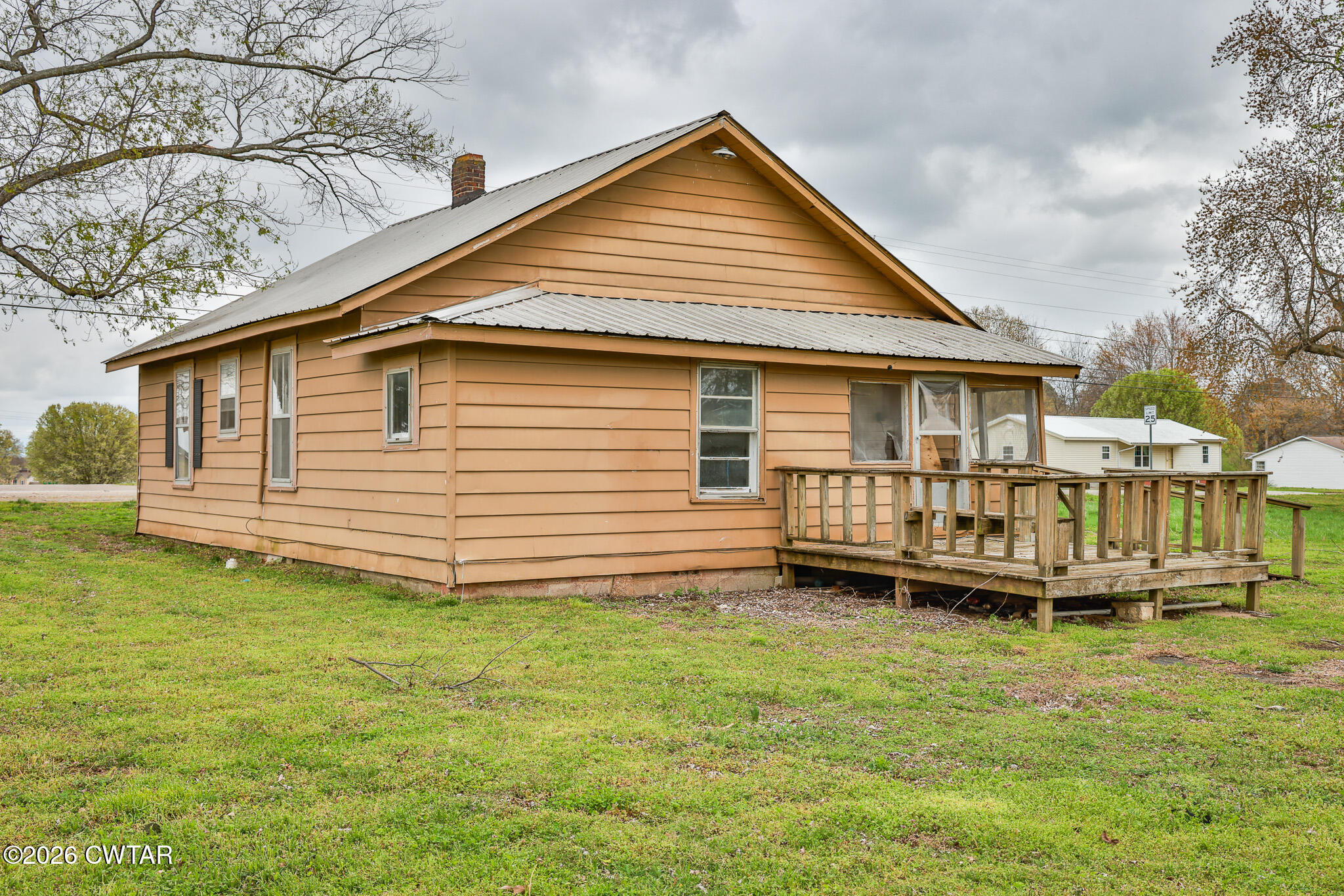 509 North Cedar Street Gleason, TN 38229 - Photo 19 of 26 a view of a house with a yard and deck