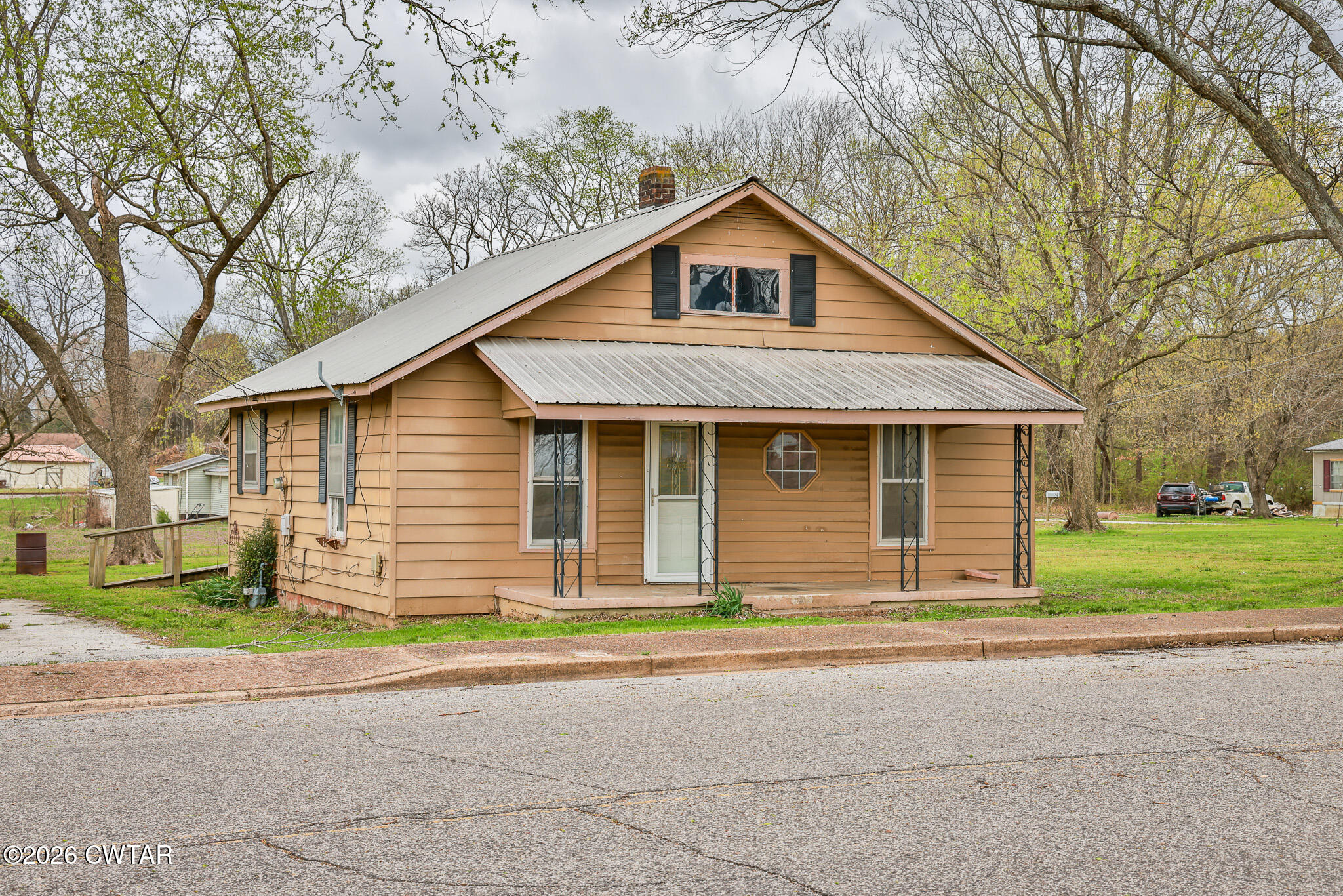 509 North Cedar Street Gleason, TN 38229 - Photo 26 of 26 a front view of a house with a yard and garage