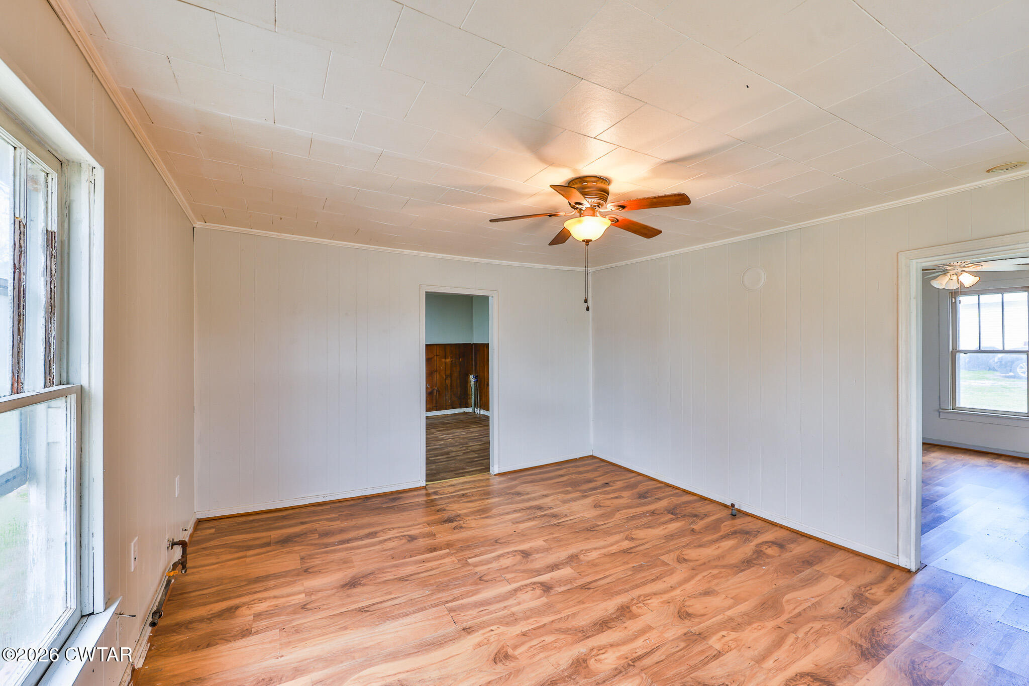509 North Cedar Street Gleason, TN 38229 - Photo 4 of 26 a view of a room with a ceiling fan and a window