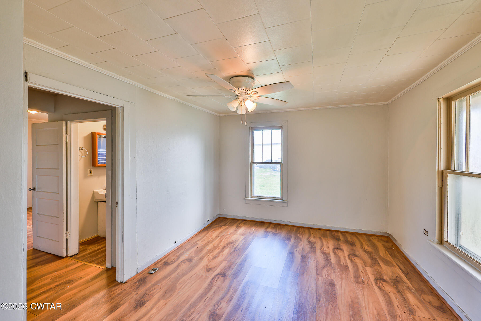 509 North Cedar Street Gleason, TN 38229 - Photo 5 of 26 wooden floor in an empty room with a window