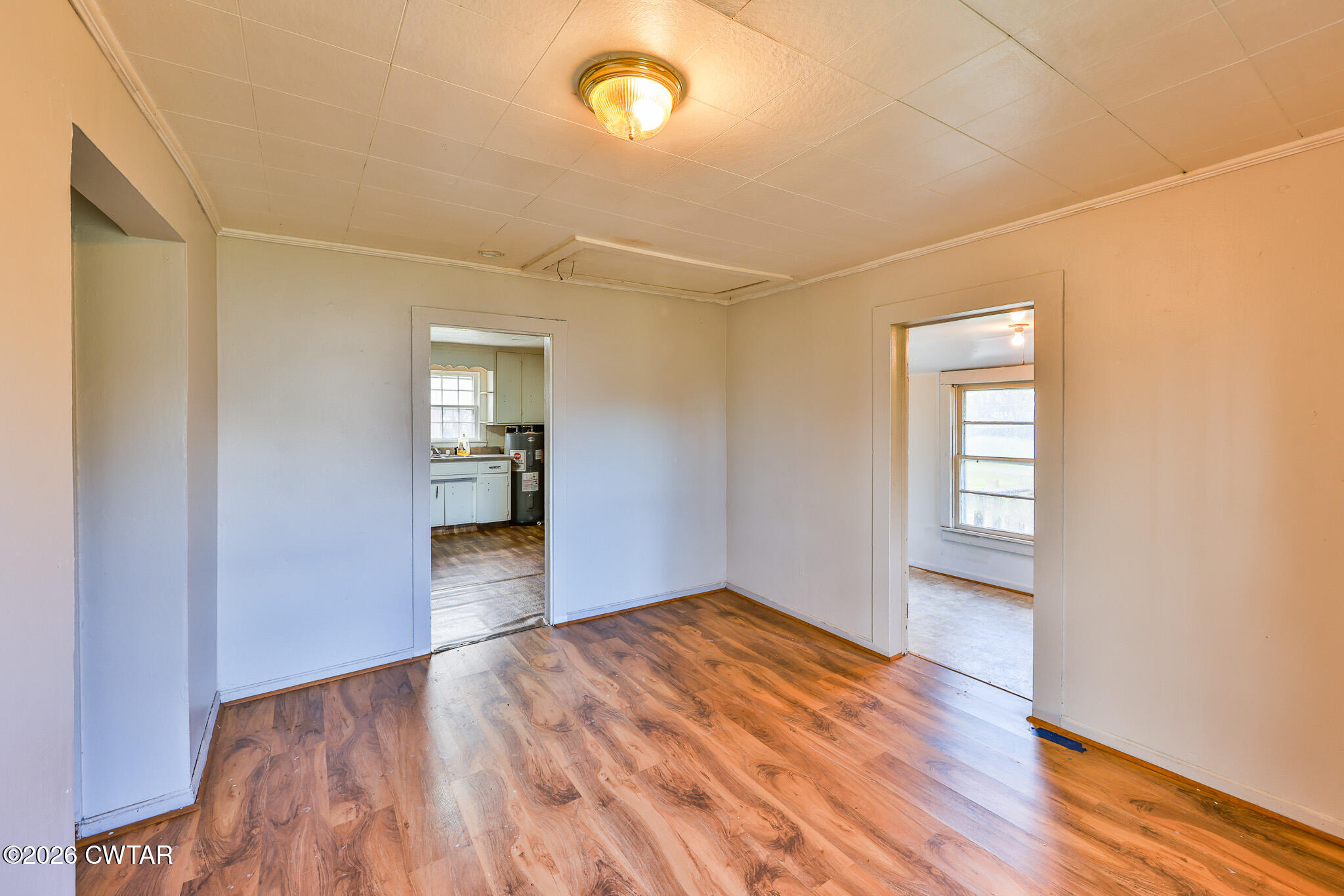 509 North Cedar Street Gleason, TN 38229 - Photo 8 of 26 a view of empty room with wooden floor and fan