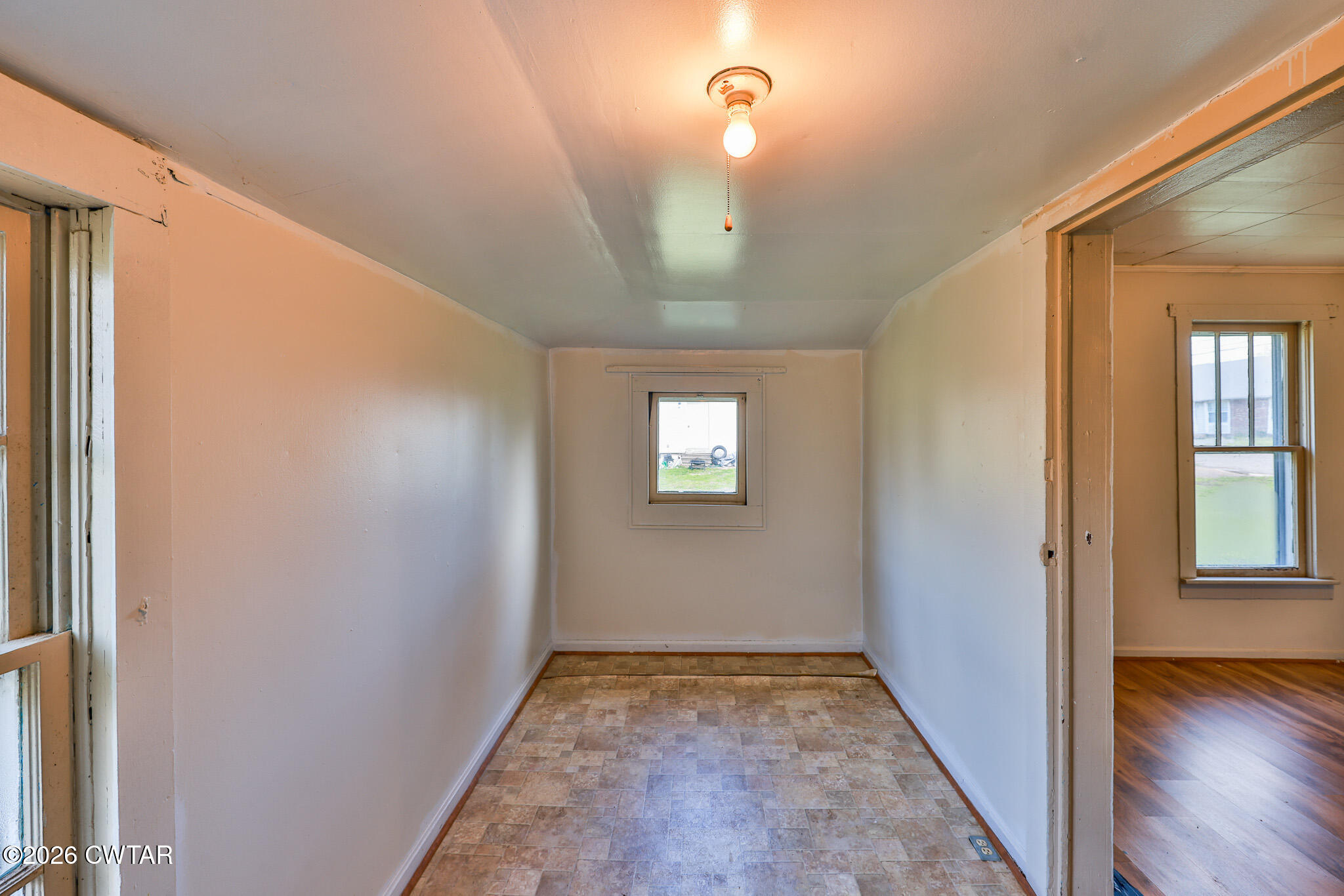 509 North Cedar Street Gleason, TN 38229 - Photo 10 of 26 a view of hallway with window and wooden floor