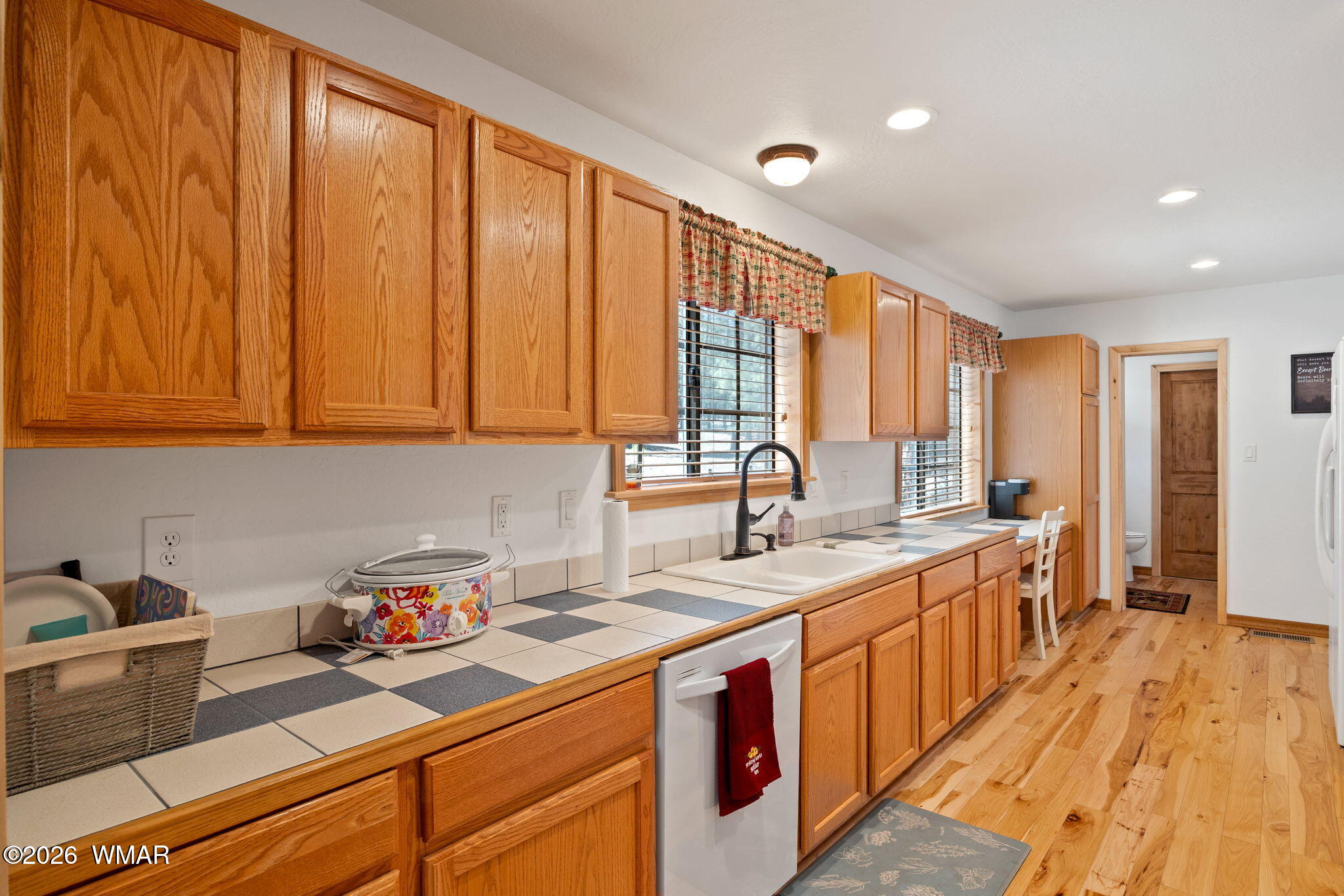 48 North 1068th Street Greer, AZ 85927 - Photo 9 of 37 a kitchen with a sink and cabinets