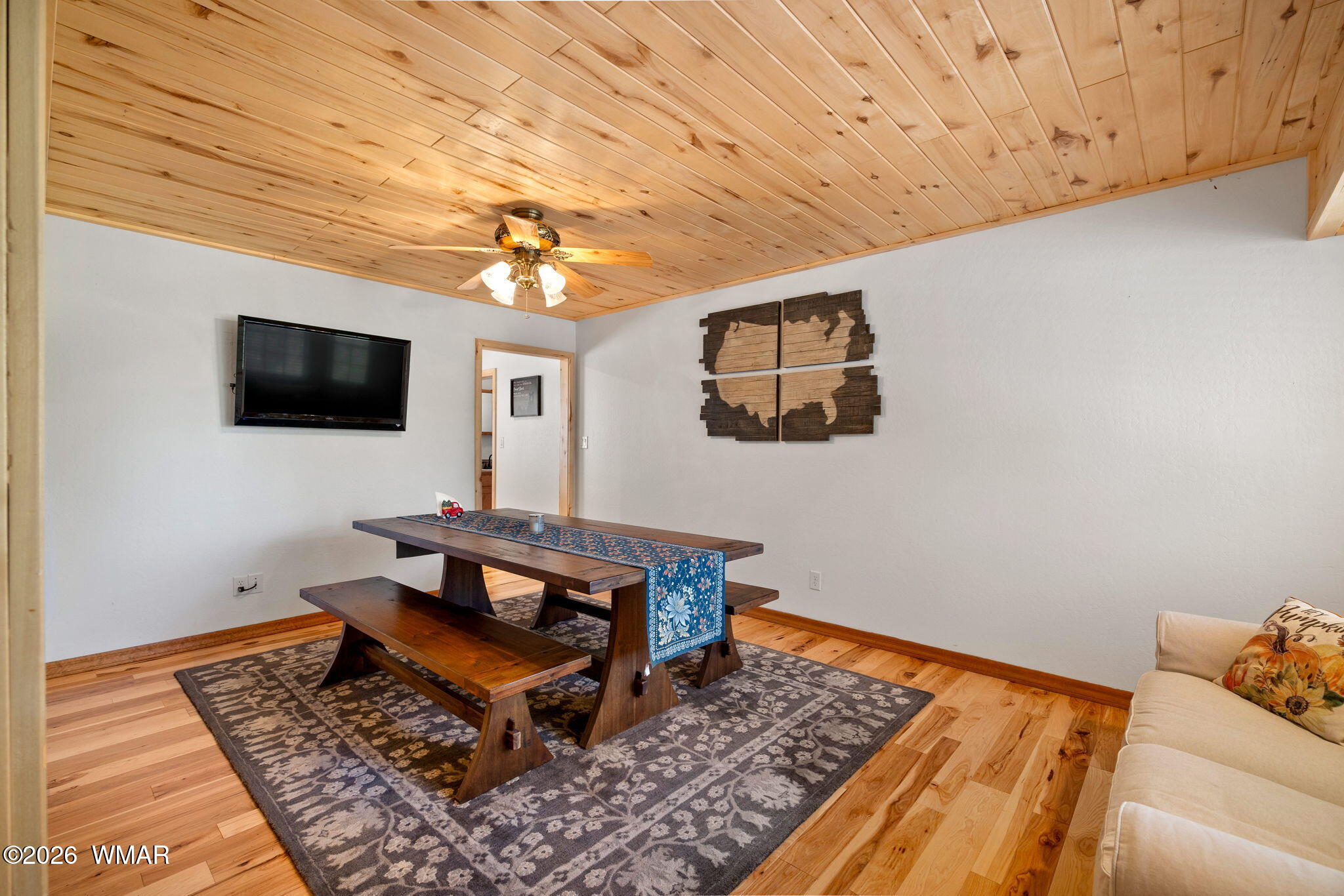 48 North 1068th Street Greer, AZ 85927 - Photo 13 of 37 a living room with a couch and a flat screen tv