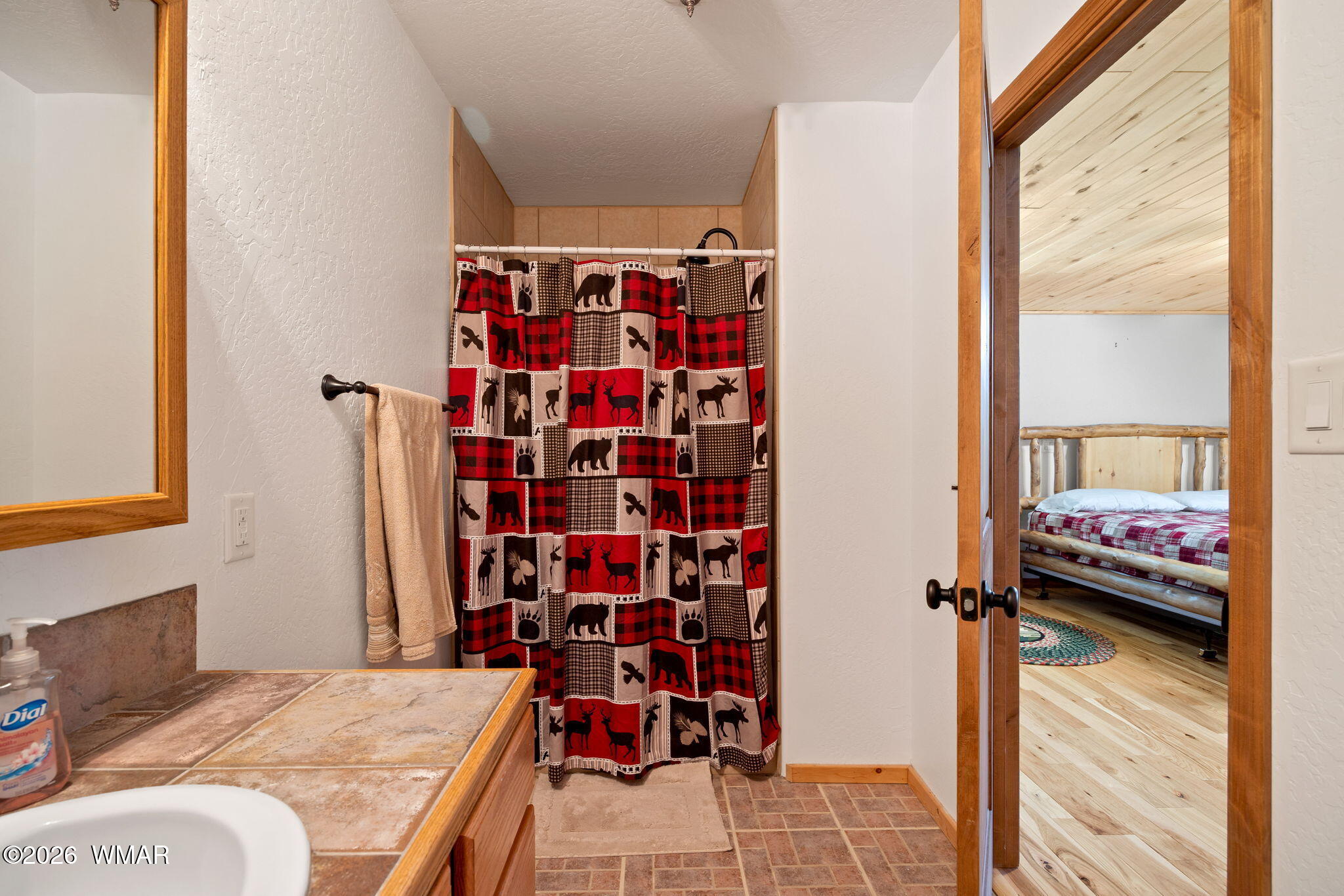 48 North 1068th Street Greer, AZ 85927 - Photo 21 of 37 a bedroom with a bed and a window