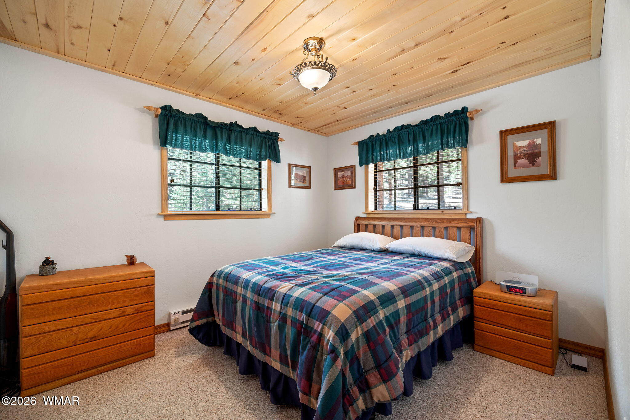 48 North 1068th Street Greer, AZ 85927 - Photo 23 of 37 a bedroom with a bed next to a window