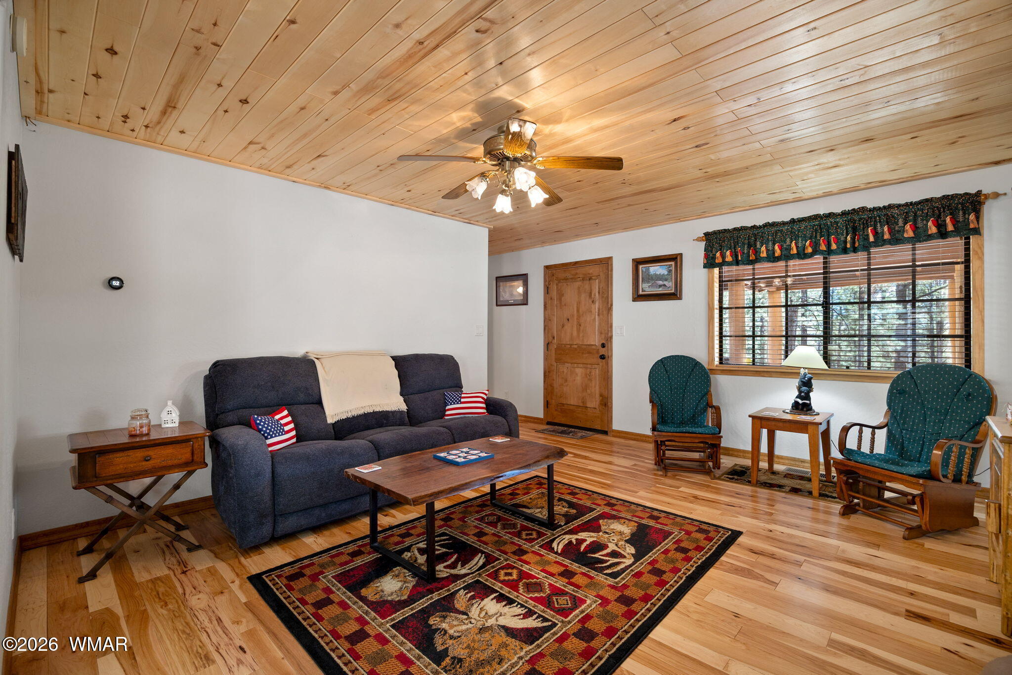 48 North 1068th Street Greer, AZ 85927 - Photo 7 of 37 a living room with furniture and a window