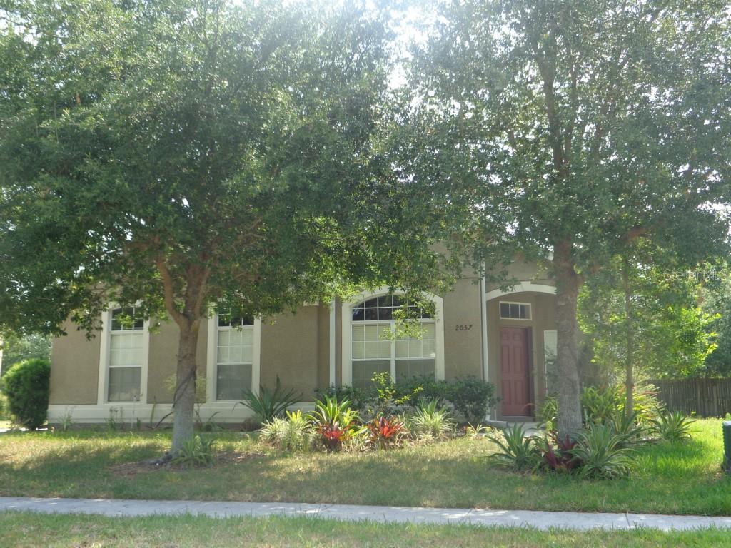 2057 Home Again Road Apopka, FL 32712 - Photo 1 of 1 front view of a house with a yard
