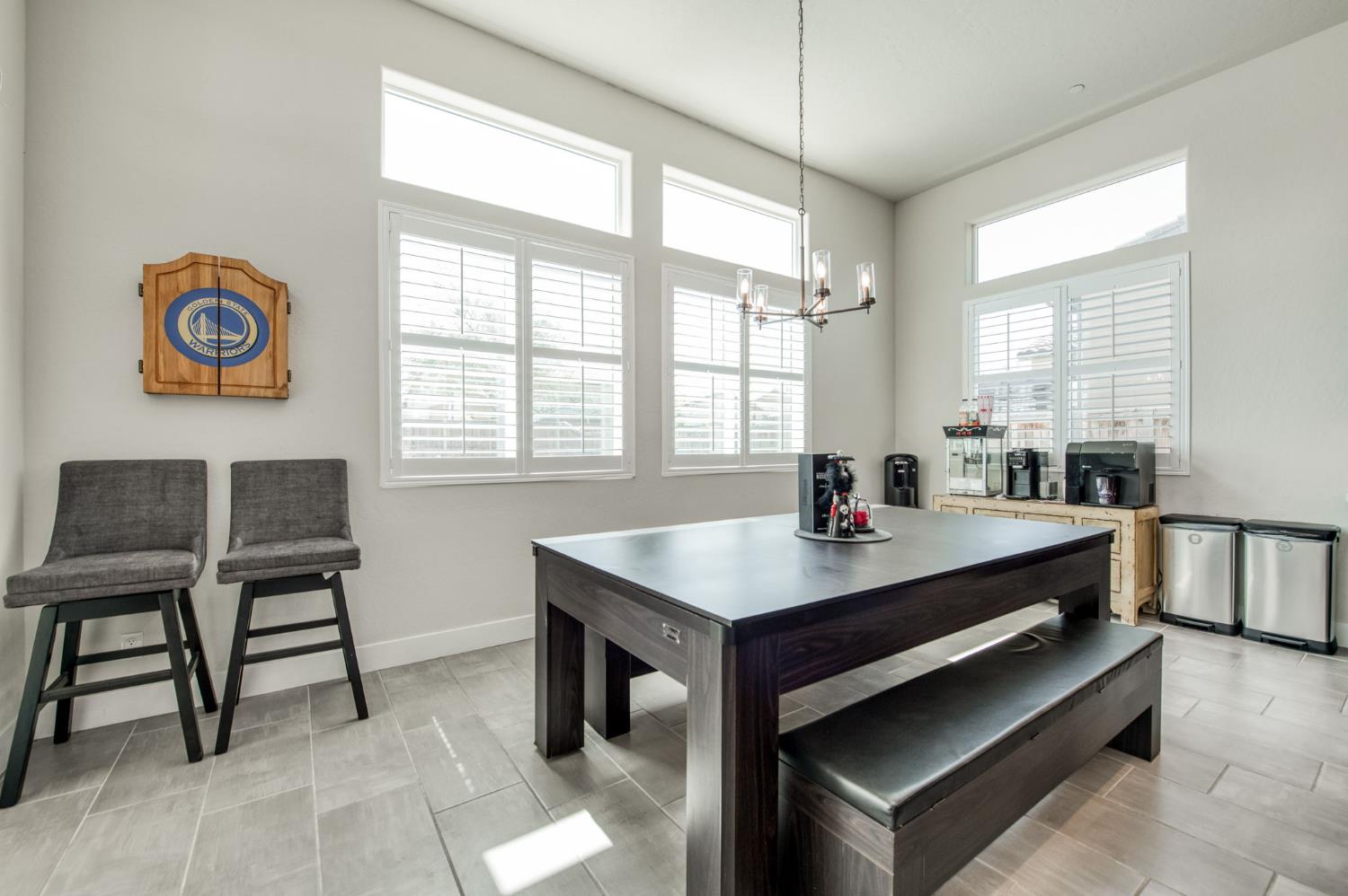 1020 Highland Road Madera, CA 93636 - Photo 12 of 42 a room with a table chairs and a window