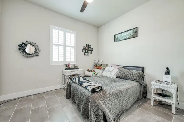 a bedroom with furniture and a window