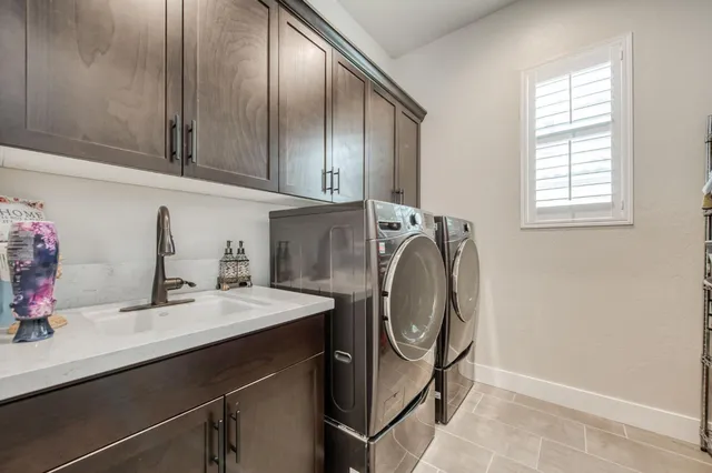 a view of a house with swimming pool and sitting area