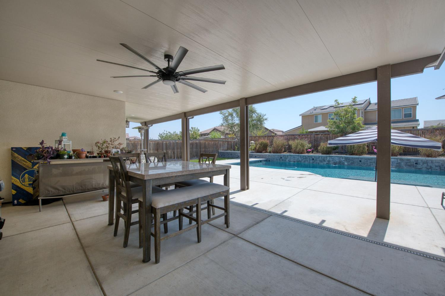 1020 Highland Road Madera, CA 93636 - Photo 28 of 42 a dining room with furniture and a floor to ceiling window