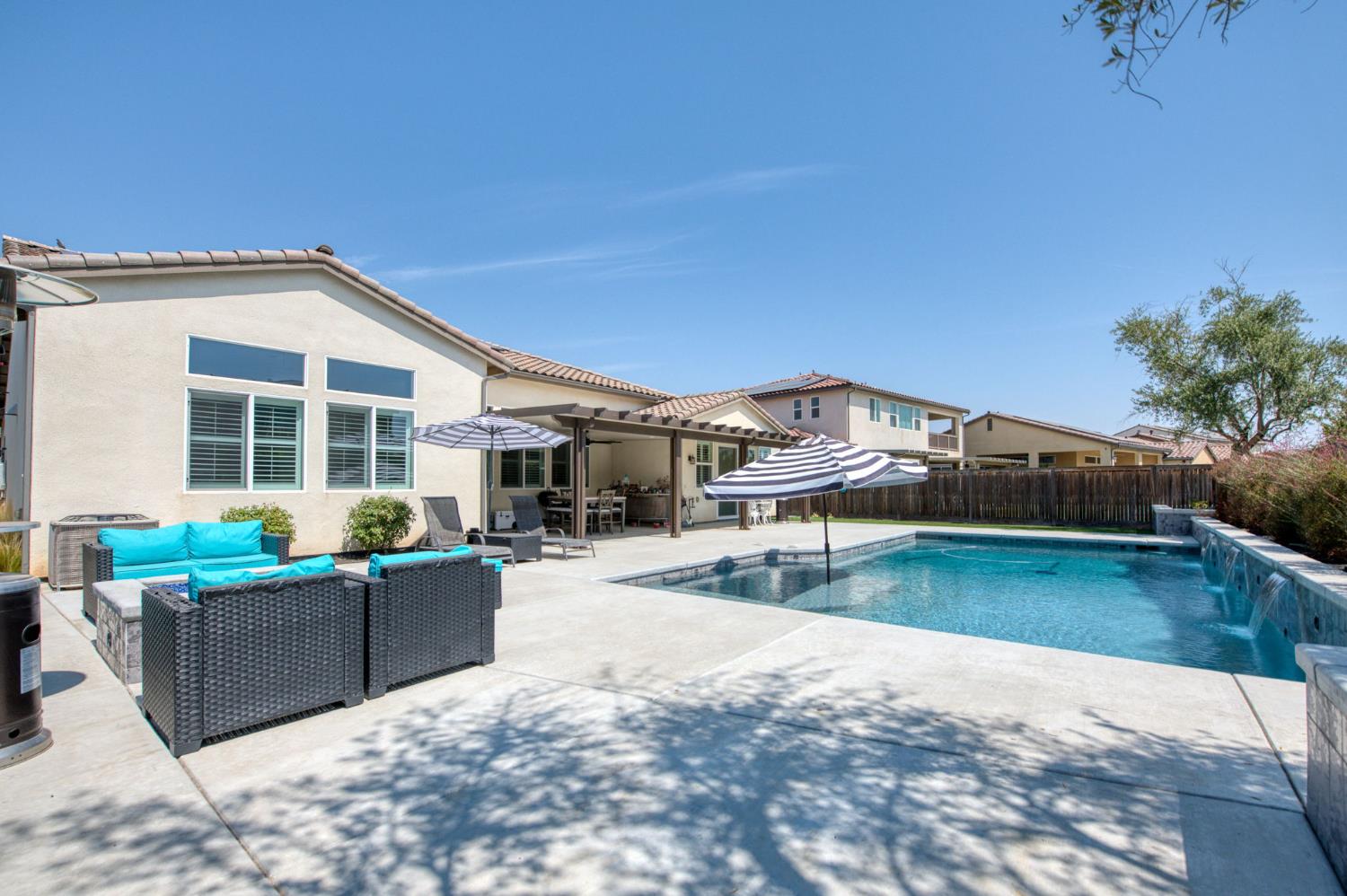 1020 Highland Road Madera, CA 93636 - Photo 30 of 42 a view of a house with pool and chairs
