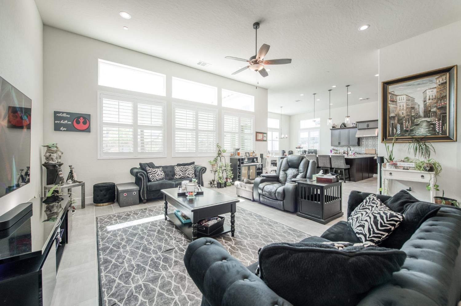 1020 Highland Road Madera, CA 93636 - Photo 7 of 42 a living room with furniture kitchen view and a large window