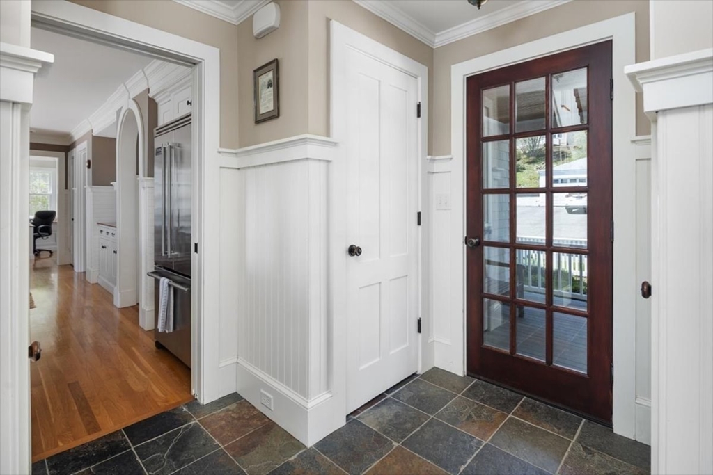 187 Downer Avenue Hingham, MA 02043 - Photo 13 of 42 a view of a hallway with windows and entryway